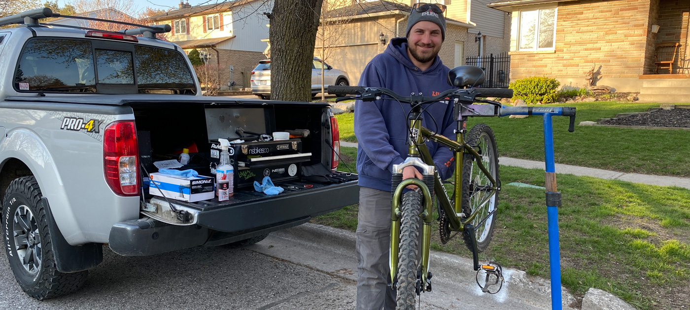 Mike doing a bike tune-up on rack