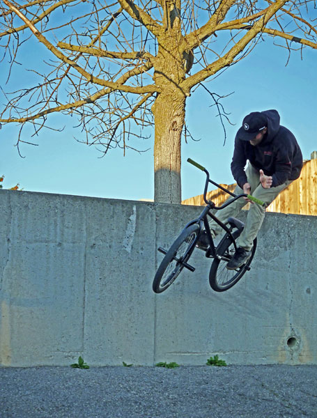 Mike on BMX off concrete wall